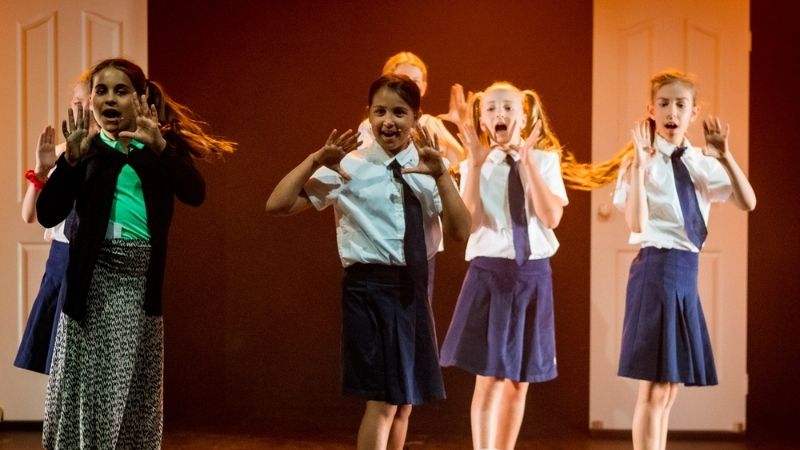Kids singing in their performing arts performance at Evoke Performing Arts Academy Palmyra Perth