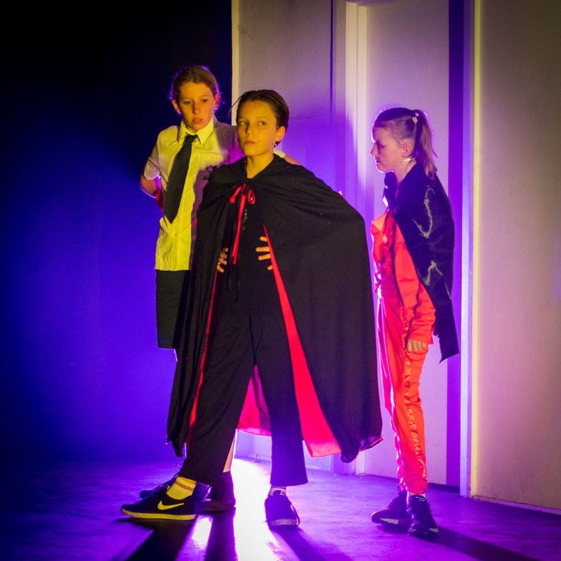 Students posing onstage in a performance with kids evoke performing arts classses Palmyra, Perth WA.